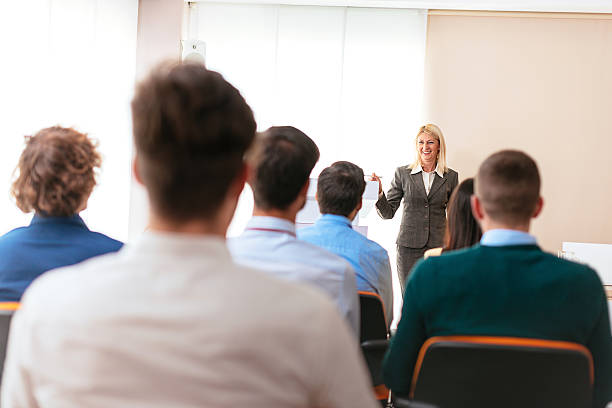 istock Female professor having lecture with her students 613762366