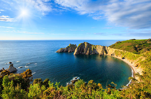 Summer sunshiny top view on Del Silencio (Gaviero) beach (Biscay Bay, Asturias, Spain). Atlantic Ocean coastline landscape.