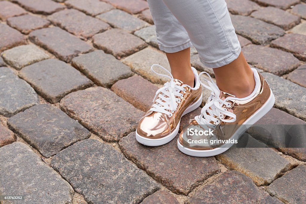 Woman with stylish shoes in the city Sports Shoe Stock Photo