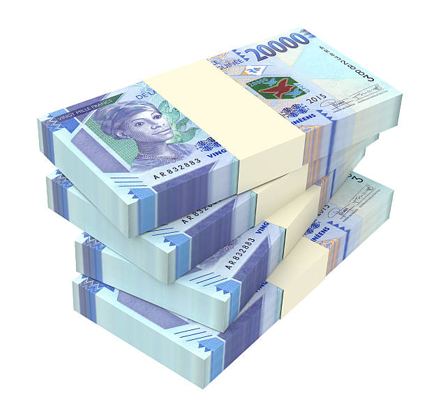istock Guinean francs bills isolated on white background. 613763394