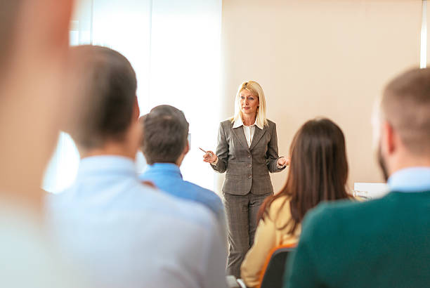 istock Formal lecturer talking to participants on seminar 613763408