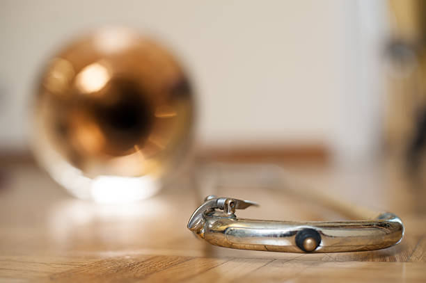 istock Trombone on wooden floor detail 613763976