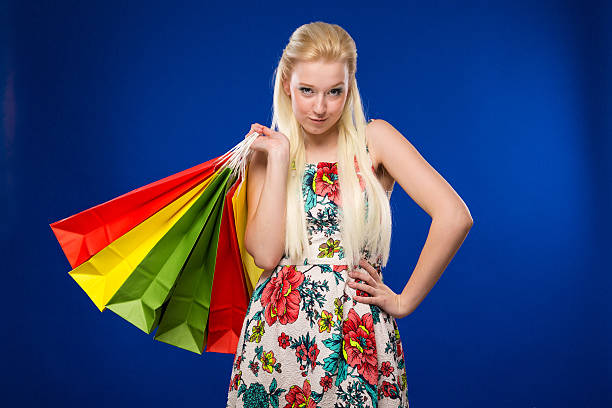 istock young girl with packages 613764060
