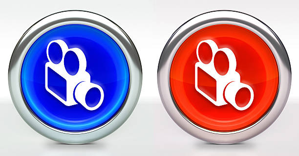 Film Camera Icon on Button with Metallic Rim. The icon comes in two versions blue and red and has a shiny metallic rim. The buttons have a slight shadow and are on a white background. The modern look of the buttons is very clean and will work perfectly for websites and mobile aps.