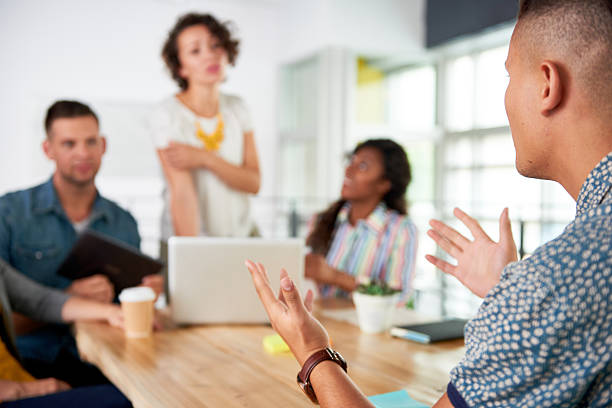 istock Multi ethnic group of succesful creative business people using a 613764736