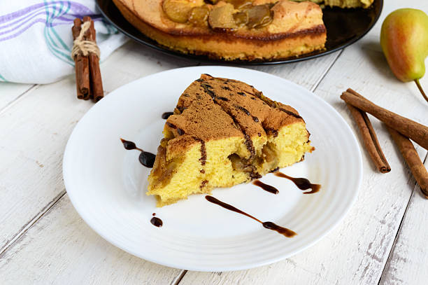 Piece of home baked biscuit flavored pear charlotte cake with