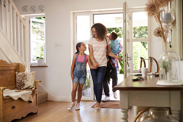 istock Family In Hallway Returning Home Together 613765326