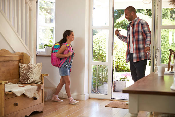 istock Girl Leaving Home For School With Father 613765348