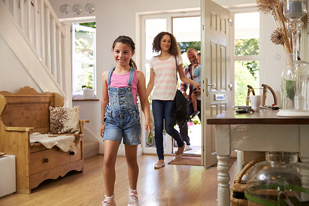 istock Family In Hallway Returning Home Together 613765370