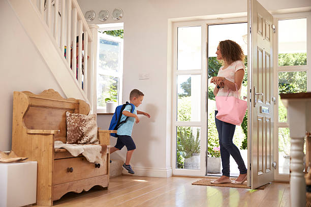 istock Boy Leaving Home For School With Mother 613765382