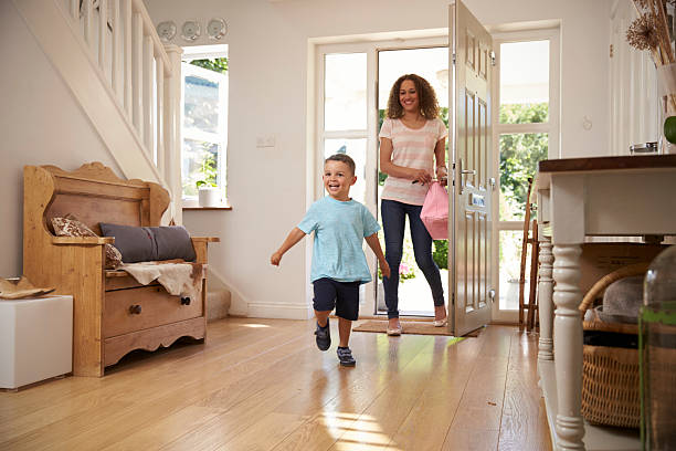 istock Excited Boy Returning Home From School With Mother 613765466