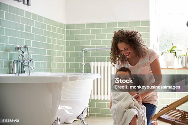 Mother Drying Son With Towel After Bath Stock Photo - Download Image Now - Child, Bathtub, Family