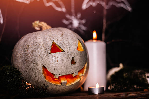 istock Halloween pumpkin and candles decoration 613766416