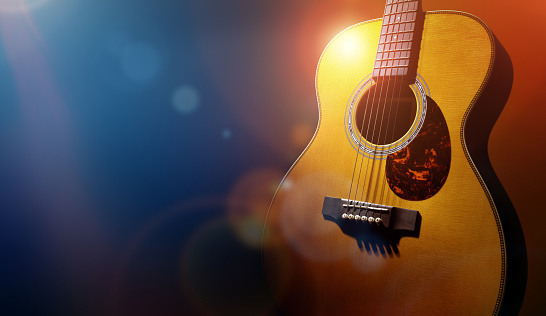 istock Guitar and blank grunge stage background 613766442