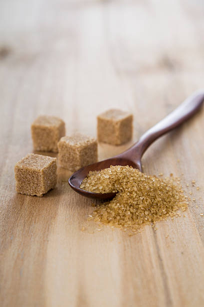 istock Cane sugar in a wooden spoon 613767176