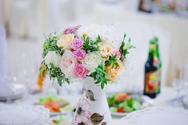 istock Wedding floristry. Beautiful lush bouquet on the table in restaurant 613767820