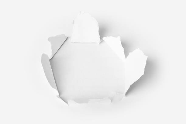 istock Hole punched in the paper 613768480