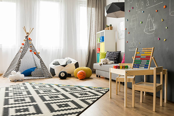 istock Bright and spacious child room idea 613769256