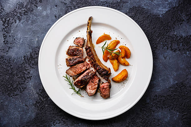 istock Sliced grilled beef rib on plate with potato 613769706