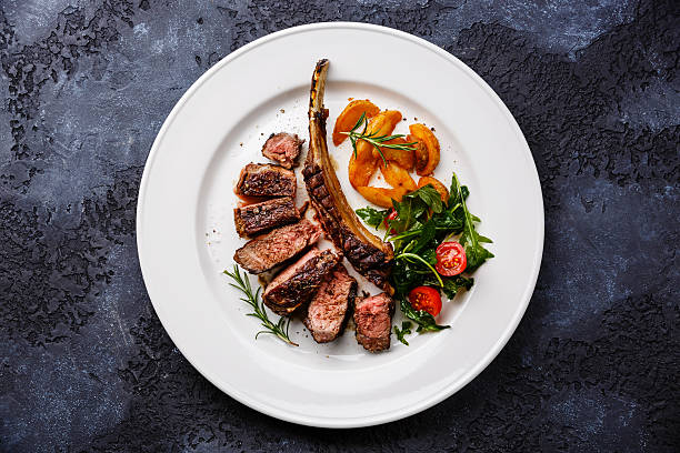 istock Sliced grilled beef rib on plate with potato 613769716