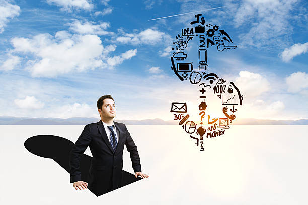 istock Businessman looking at dollar sign 613770838