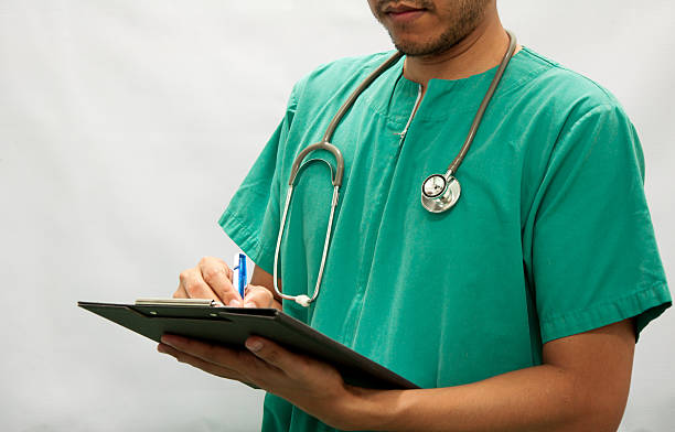 Doctor writing a medical prescription