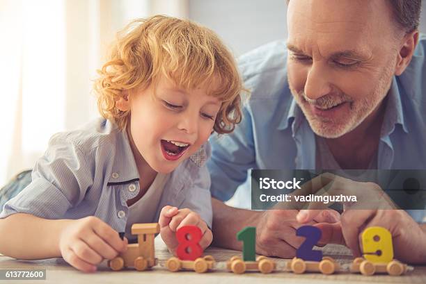 Grandpa And Grandson Stock Photo - Download Image Now - Grandparent, Child, Playing