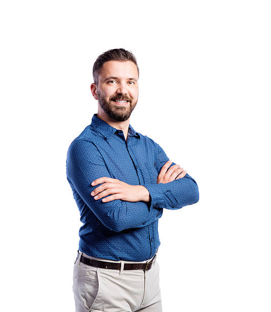 istock Hipster man in blue shirt, studio shot, isolated 613772858