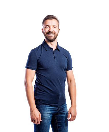 Young handsome hipster man in blue t-shirt. Studio shot on white background, isolated.