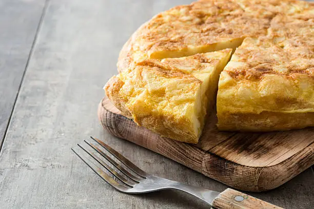 Traditional spanish omelette on wooden background