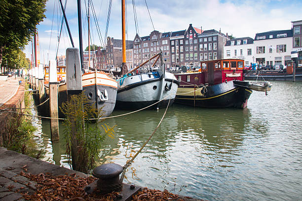 Several boats on a canal in the historical center of Dordrecht, Netherlands
