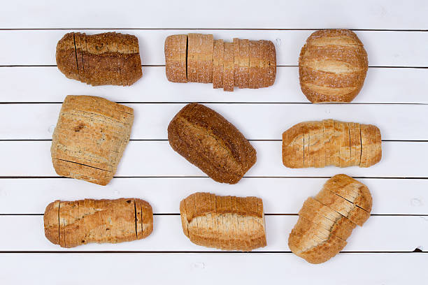 istock Sliced loaves of bread neatly aligned 613774594
