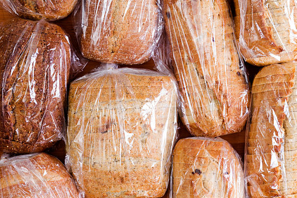 Assortment of different sliced loaves of bread stock photo