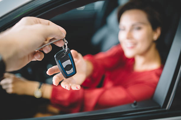 istock Woman taking the new car keys 613777416