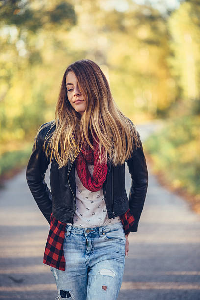 istock Girl walking among nature 613777512