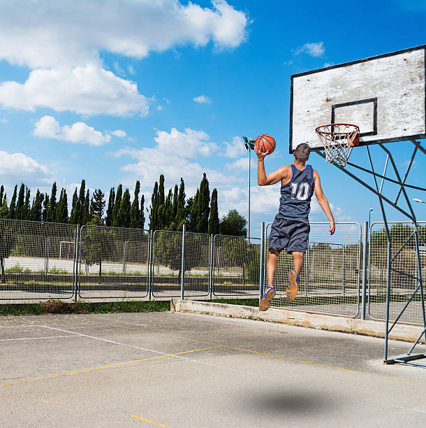 istock dunking in a basketball playground 613777970