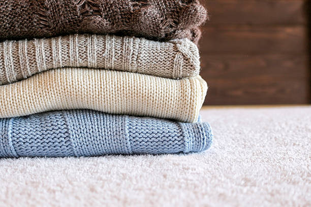 istock Stack of cozy knitted warm sweater 613779248
