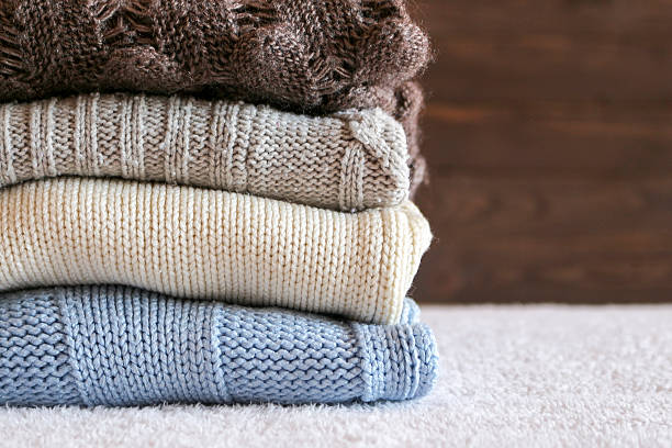 istock Stack of cozy knitted warm sweater 613779586