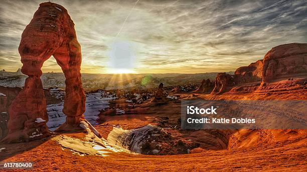 Delicate Arch Snow Swirly Basin Sunset Arches National Park Utah Stock Photo - Download Image Now