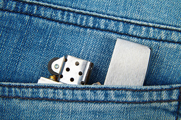 istock Lighter in the back pocket of jeans 613780602