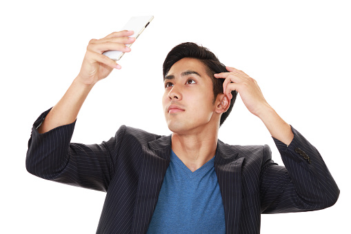 Asian man holding a smart phone