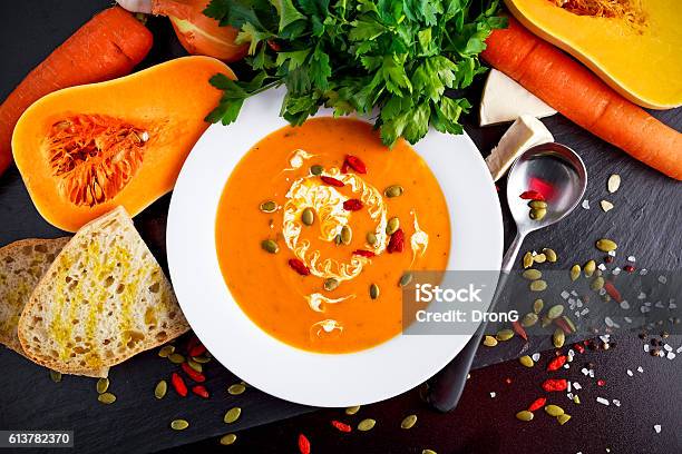 Smooth Butternut Squash And Carrot Soup With Cream Pumpkin Seeds Stock Photo - Download Image Now