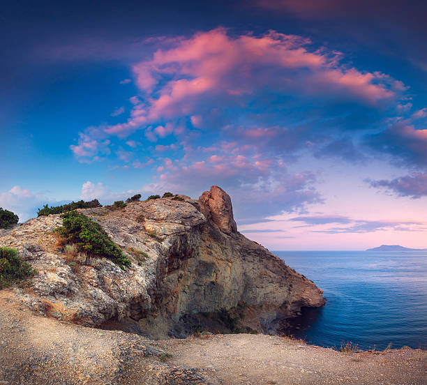 istock Beautiful panoramic landscape with mountains, sea at sunset 613782558