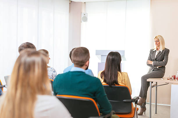 istock Female professor having lecture with her students 613783342