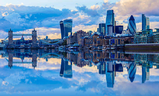 London Cityscape at Sunset London cityscape and its reflection from river Thames at sunset central london photos stock pictures, royalty-free photos & images