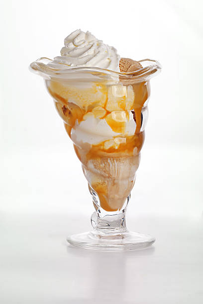 istock Vanilla peanut ice cream with whipped cream 613783952