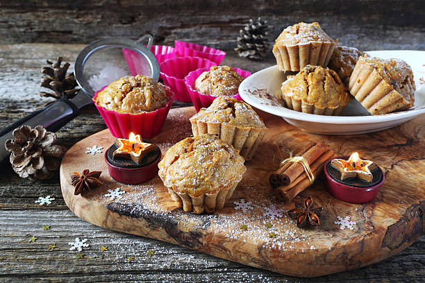 istock Spiced Carrot muffins and burning candles 613784626