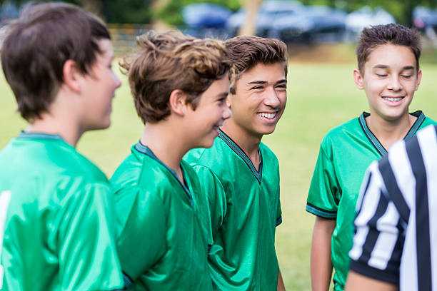 istock Soccer players smile confidently before game 613784936