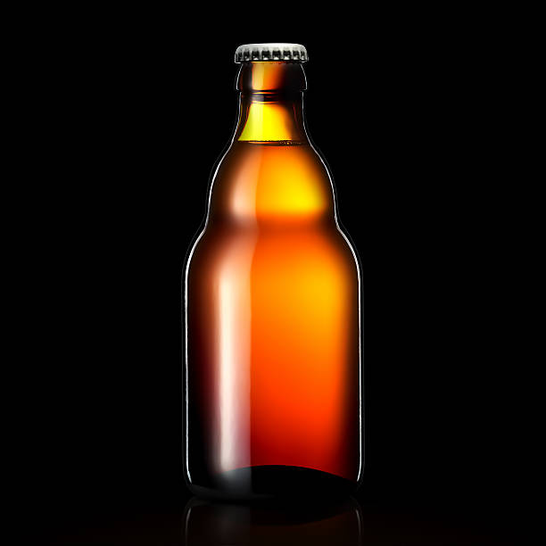 istock Bottle of beer or cider isolated on black background 613787580