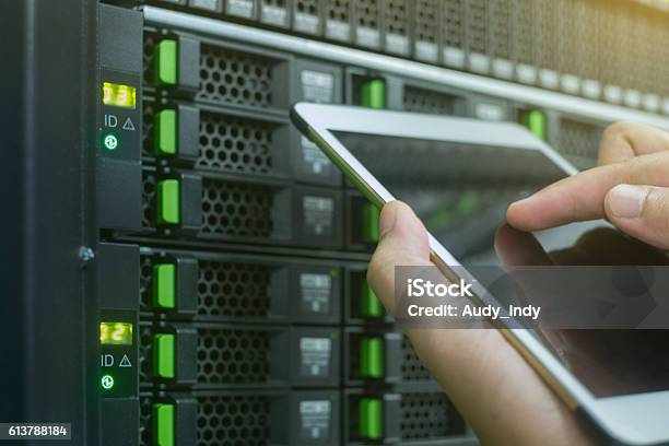 Close Up Use Tablet In Data Center Stock Photo - Download Image Now - Data Center, Repairing, Mobile Phone